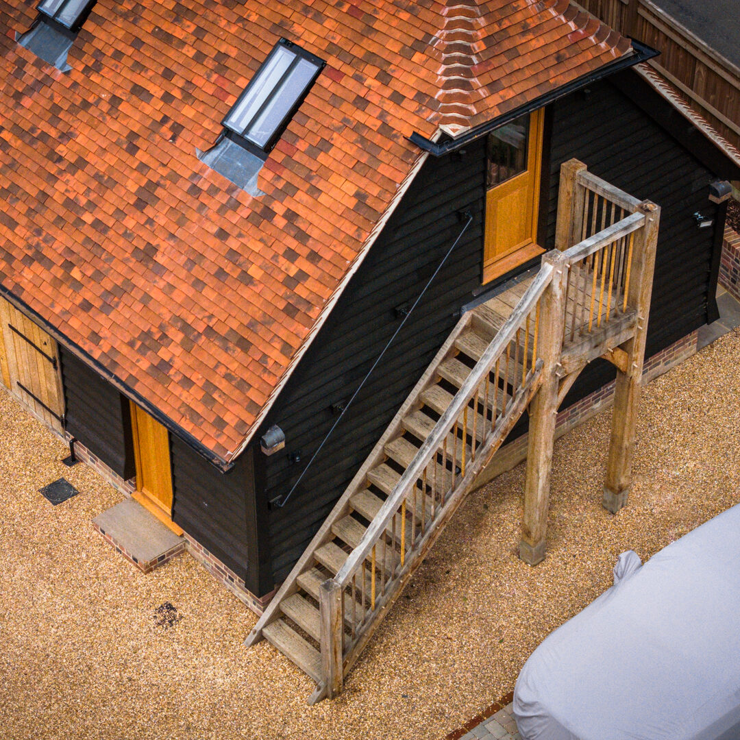 Oak-framed garage with external staircase
