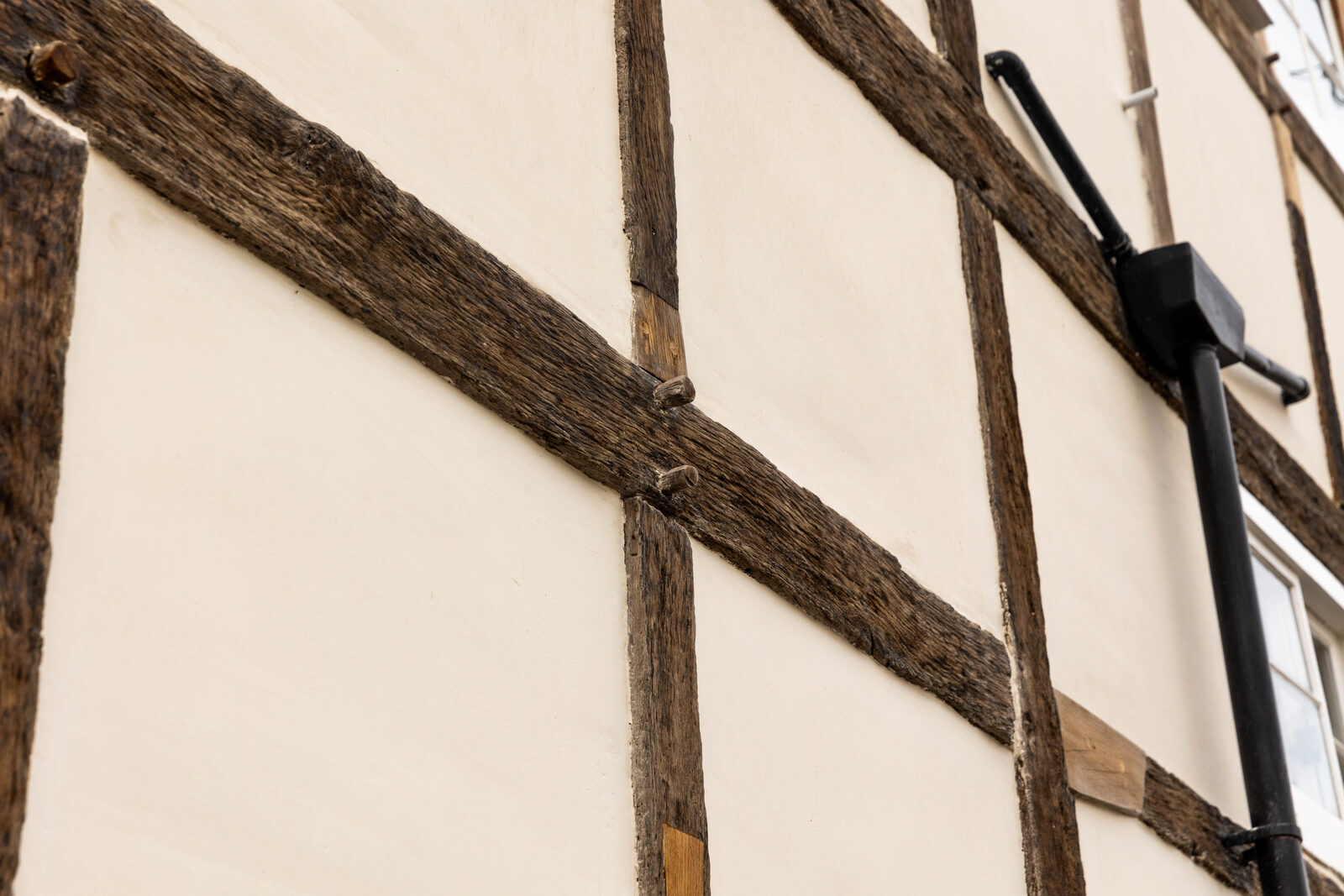 Lime finish between the timber frame of a listed cottage