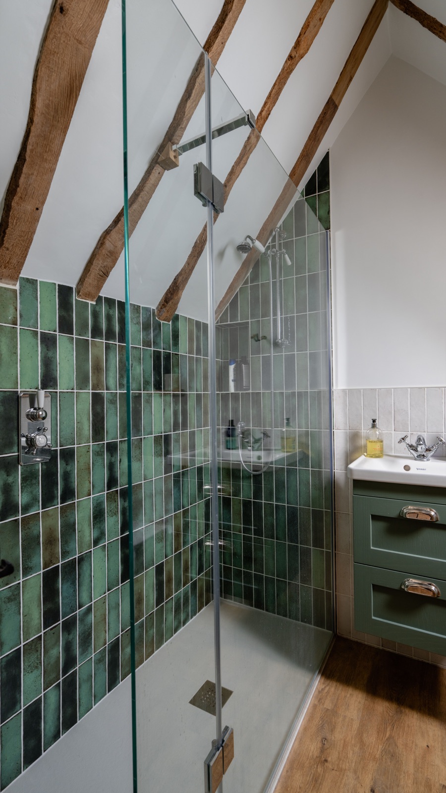 Green tiled walk-in shower in the loft en-suite