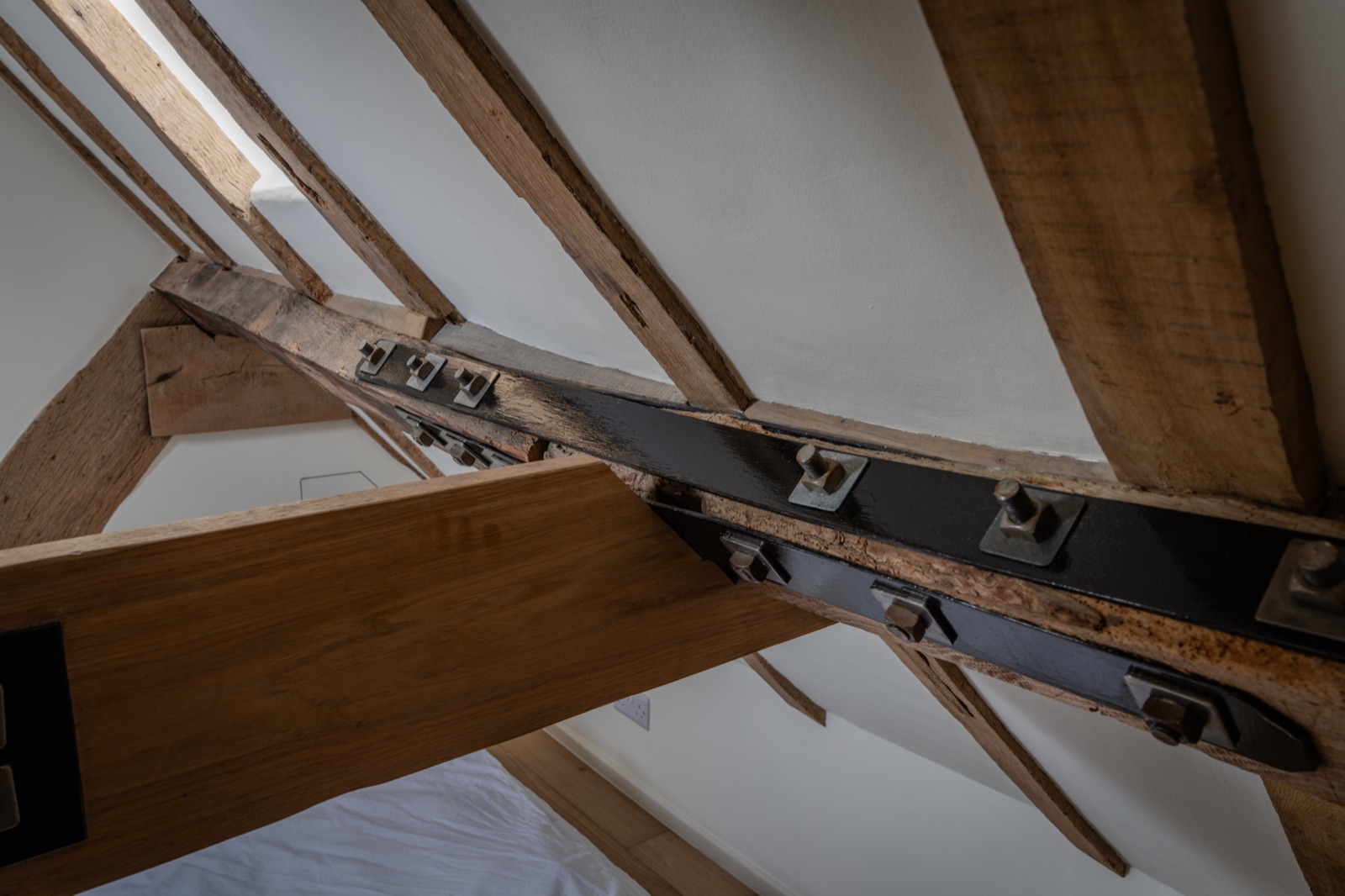 Oak-framed loft room with exposed roof trusses